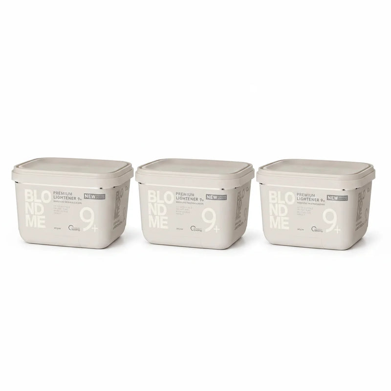 Three rectangular plastic containers of BLOOM ME 9+ Premium Lightener in a light beige color, arranged side-by-side on a white background.