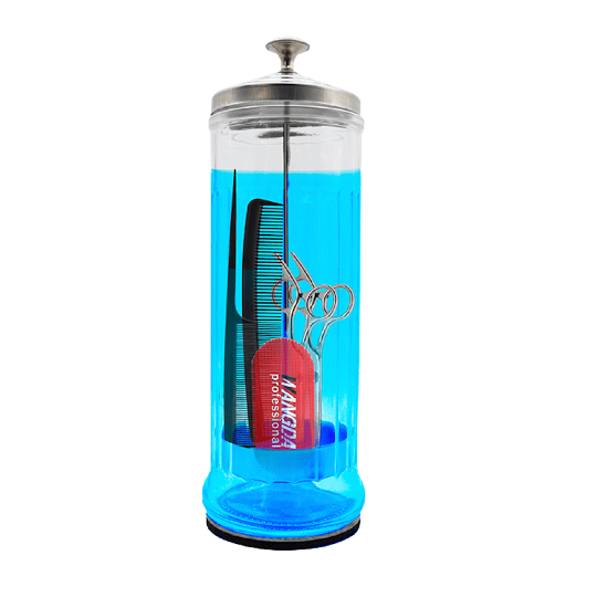 Glass hair salon disinfecting container with hairdressing tools inside on a white background