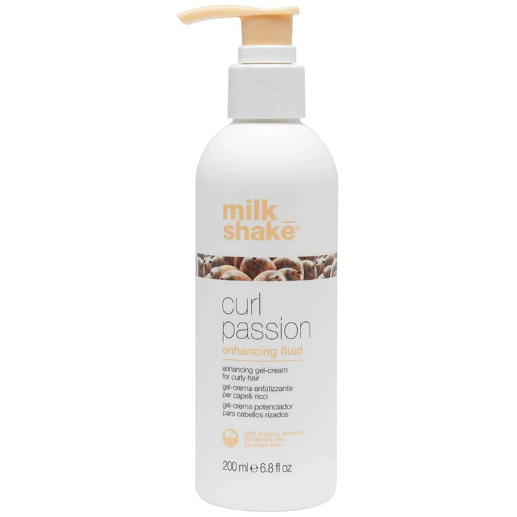 White bottle of 'milk_shake' curl passion enhancing fluid on a white background