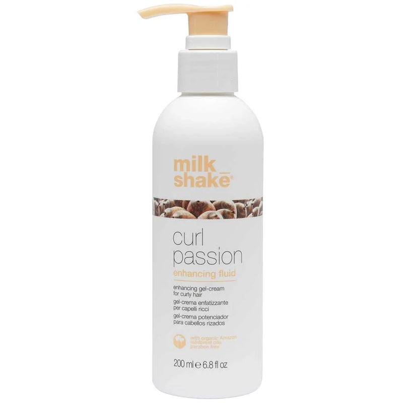 White bottle of 'milk_shake' curl passion enhancing fluid on a white background