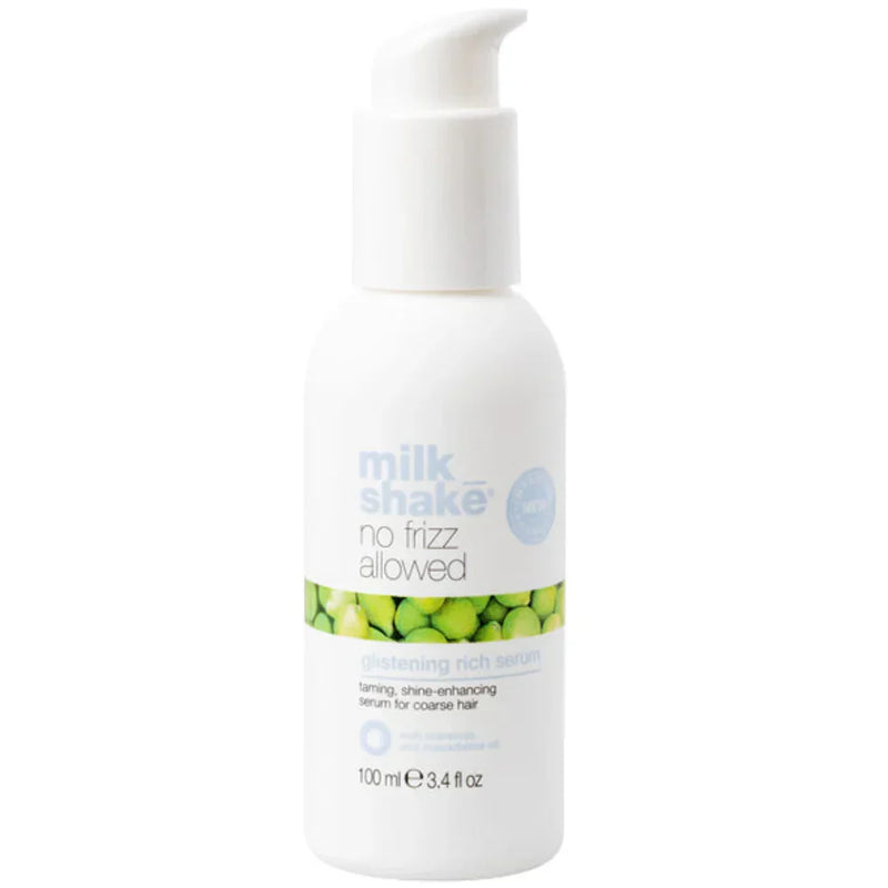 White bottle of 'milk shake no frizz glistening rich serum' product with green label on a white background