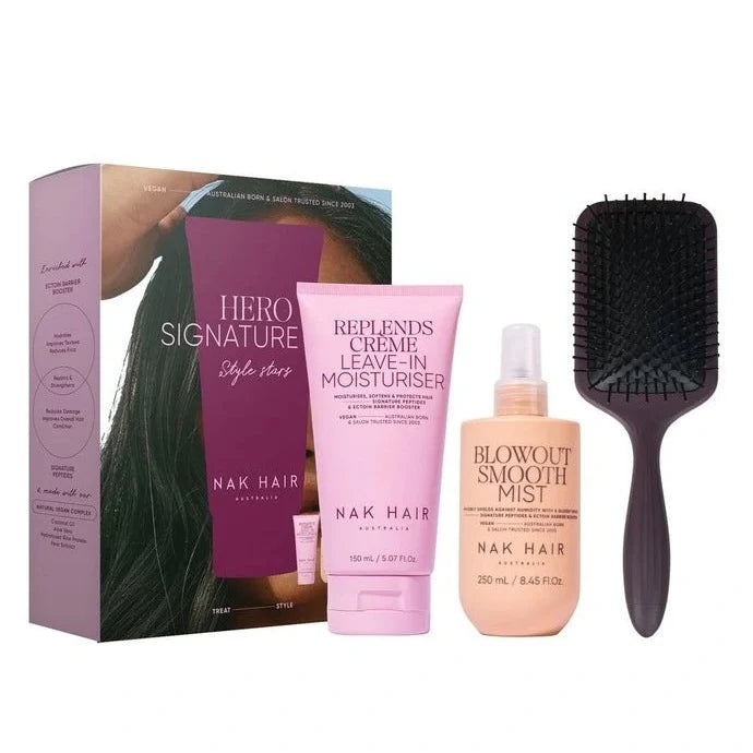 Nak Hair product set including a box, bottle, and brush on a white background