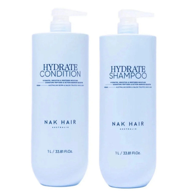 Two bottles of NAK Hair Hydrate Shampoo and Conditioner on a white background