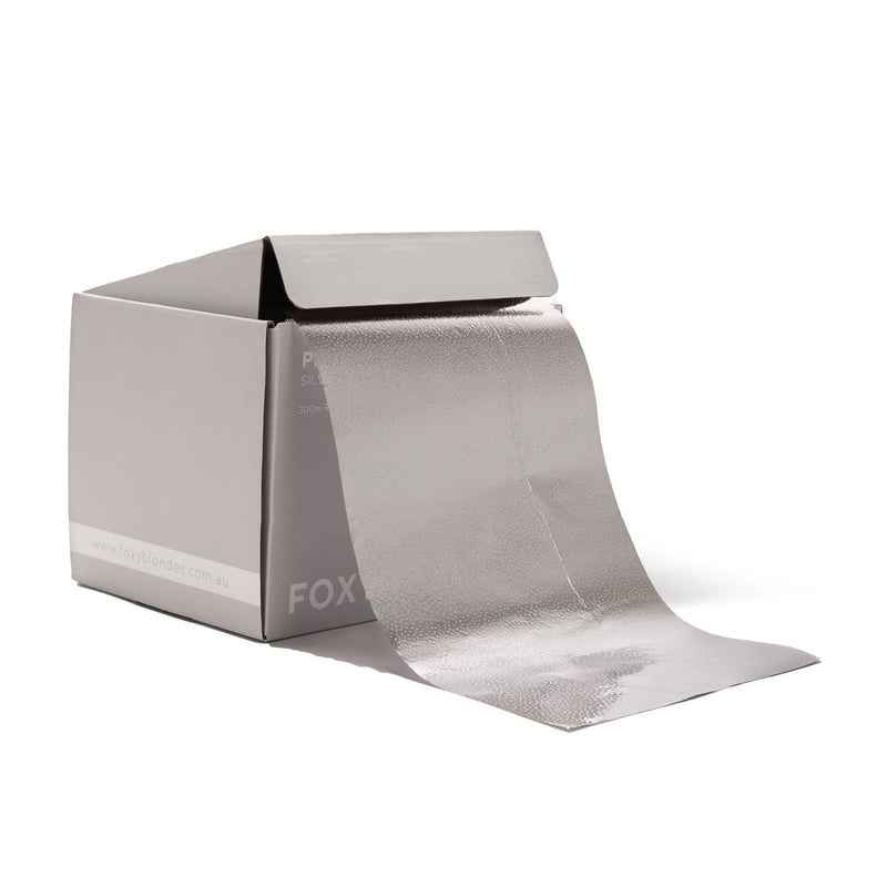 Roll of tinfoil with a box on a white background