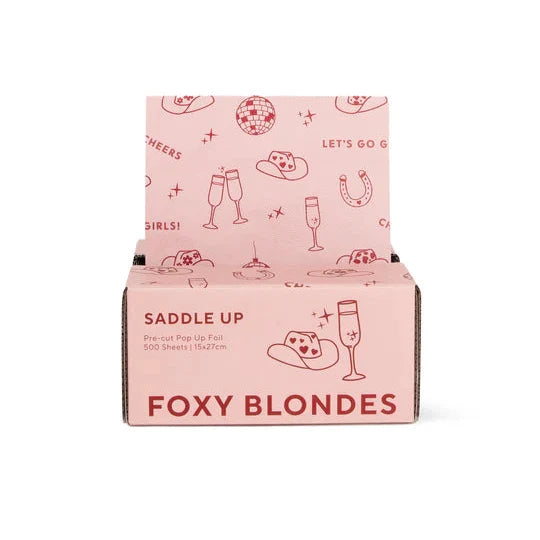 Pink packaging box with 'Foxy Blondes' branding and graphics on a white background
