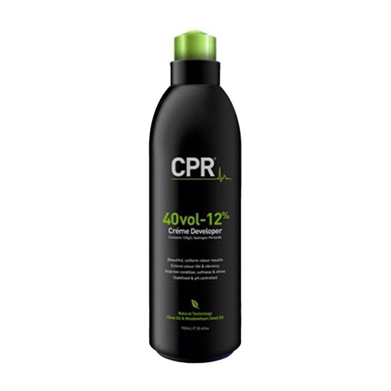 Black bottle of CPR Creme Developer with green cap on a white background