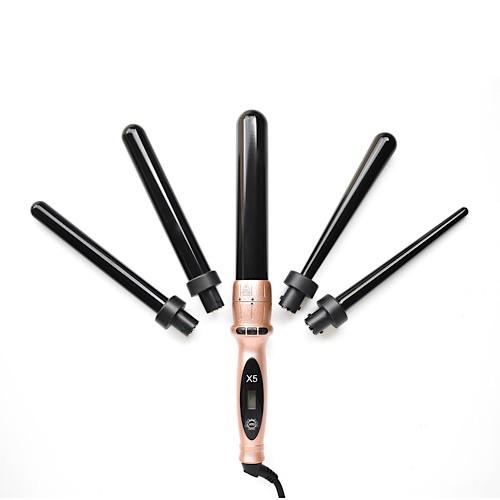 Hair curling iron with interchangeable barrels on a white background
