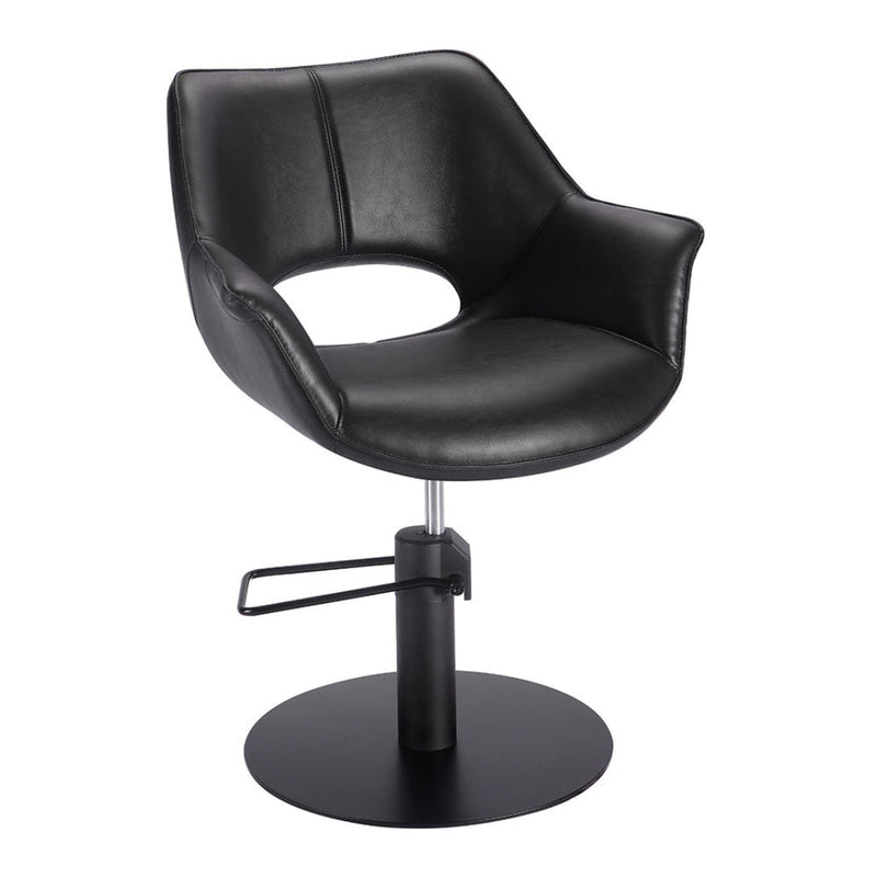 Black leather salon chair with adjustable base on a white background