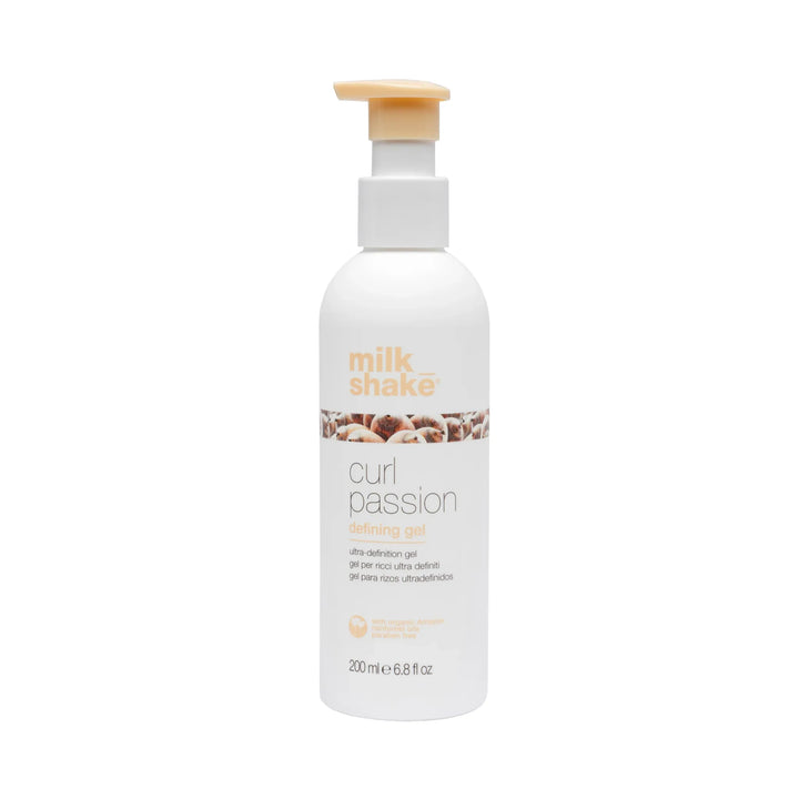 Bottle of Milk Shake Curl Passion defiing gel product on a white background