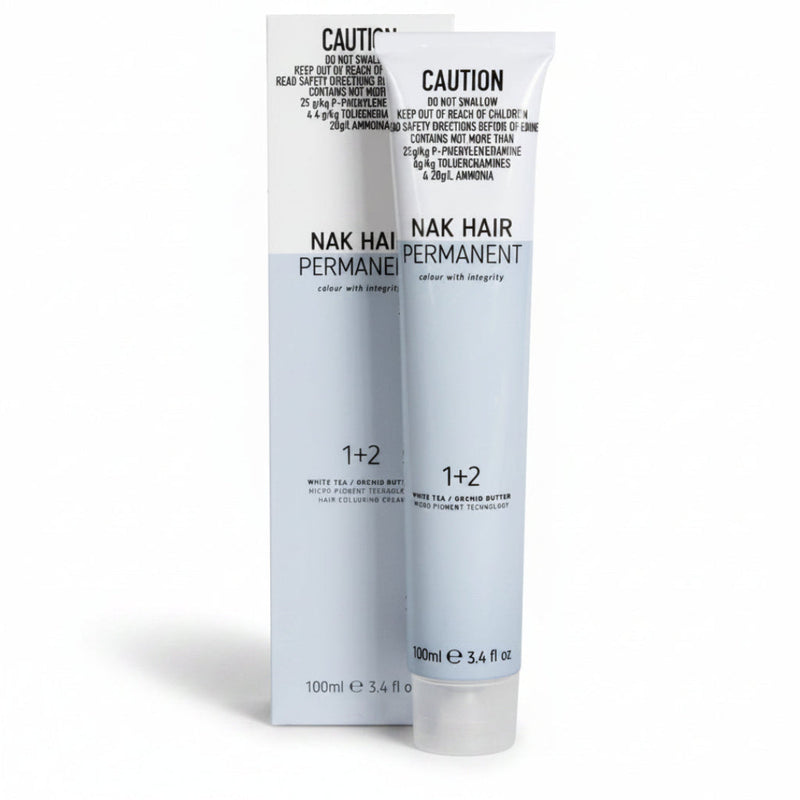Nak Hair Permanent hair color 1+2 developer and color cream set in white tubes with black text, shown against a plain white background.