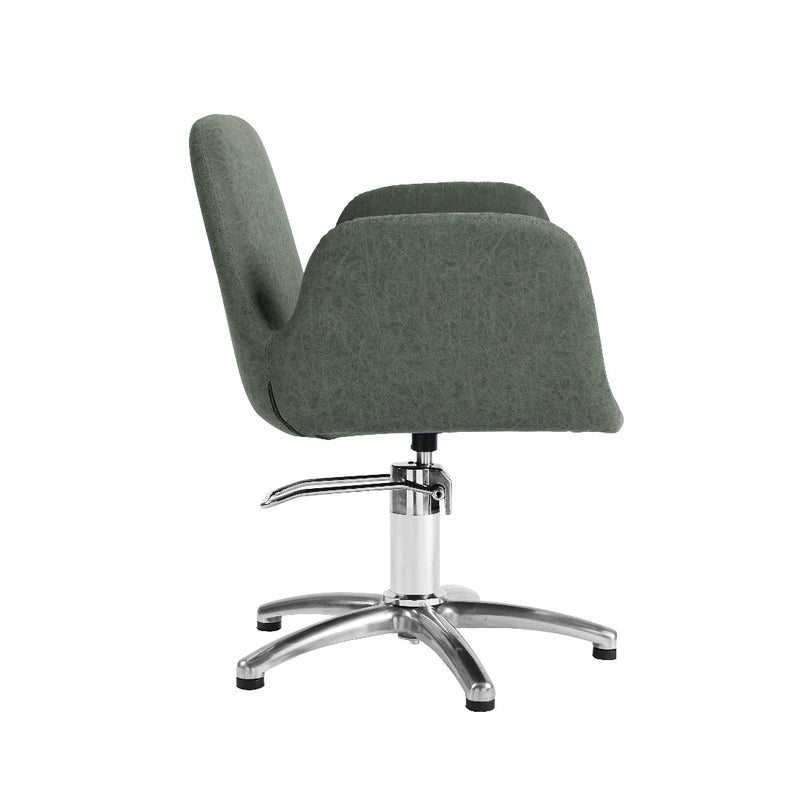 A modern upholstered salon chair with a dark green fabric seat and back, supported by a chrome five-star base on a white background.