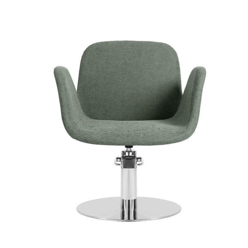 A modern swivel salon chair upholstered in textured sage green fabric, mounted on a polished chrome pedestal base with a circular footrest, shown against a plain white background.