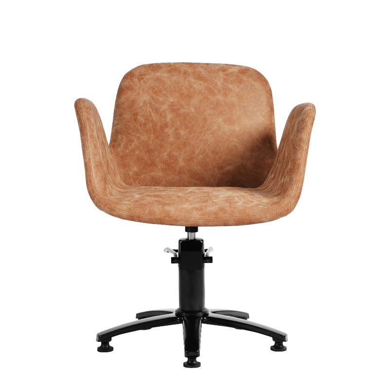 A modern swivel salon chair with a rounded, molded seat and back upholstered in a textured tan leather or faux leather, mounted on a black five-star wheeled base.