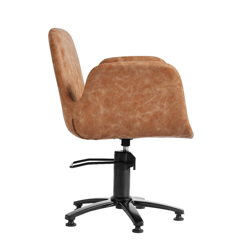 A modern office chair with a curved, cushioned seat and back upholstered in a textured tan-brown fabric, supported by a black swivel base with five legs and a central armrest.